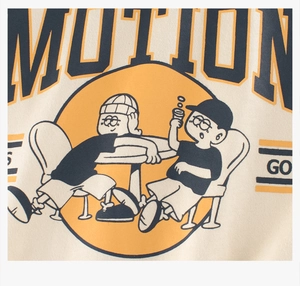 Detailed close-up of retro cartoon print on beige knitted cotton long-sleeve tee