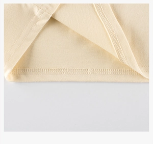 Detailed close-up showing precision double-needle stitching on cotton kids t-shirt hem