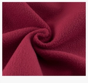 Close-up detail of soft burgundy fleece fabric showing thick plush texture for boys sweatshirt