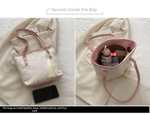 Detailed interior of a pink jacquard tote showing spacious main compartment with items