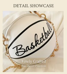 Detail shot of white basketball-shaped handbag with golden chain strap and leather texture