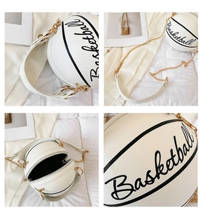 Detail view of white basketball shaped crossbody bag with gold chain and zipper closure