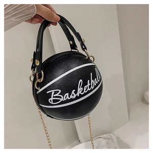 Detail view of round black basketball bag with white embroidery and golden chain strap