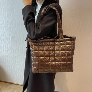 Metallic quilted oversized tote bag in bronze with puffy padded design for women