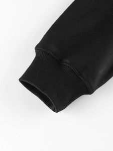 Close-up of ribbed cuffs on children's black fleece sweatshirt with detailed stitching