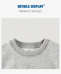 Close-up of grey fleece-lined sweatshirt showing ribbed crewneck detail and soft fabric