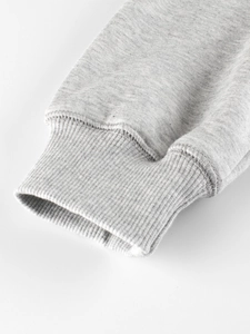 Close-up of ribbed cuffs on a premium light grey cotton sweatshirt for children