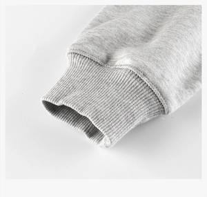 Close-up of the ribbed elastic cuffs and gray cotton texture on a children's sweatshirt