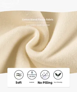 Detailed macro view of cream cotton-blend fleece fabric showing soft texture and thick lining