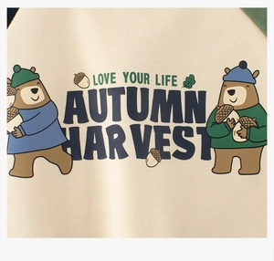 Detail showing autumn harvest bear print and 'Love Your Life' slogan on fleece sweatshirt