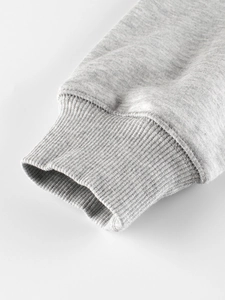 Close-up of grey sweatshirt ribbed cuffs with neat stitching and high-quality knit texture