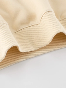 Cream fleece hoodie with ribbed cuffs and durable double-needle stitching detail
