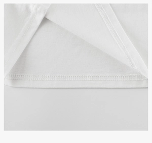 Close-up of double-stitched hem and premium cotton texture on white children's t-shirt