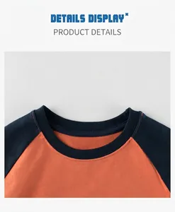 Detail of boys' raglan T-shirt showing round neckline and contrast orange stitching