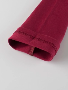 Close-up of ribbed cuffs on maroon cotton knit long-sleeve T-shirt for boys
