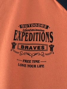 Boys' long-sleeved orange sports t-shirt with navy contrast and vintage expeditions print