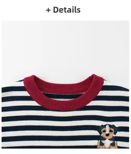 Detail of children's striped knit sweater with red ribbed neckline and puppy embroidery
