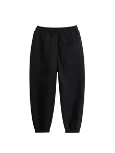Kids black cotton jogger pants with elastic waist and ribbed cuffs on white background