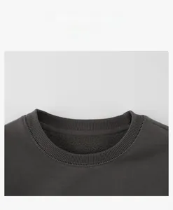 Detail view of ribbed crewneck collar on dark grey fleece sweatshirt for kids