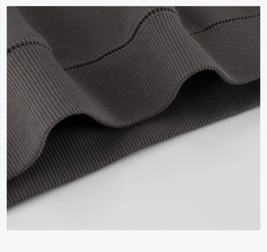 Macro shot of dark grey sweatshirt ribbed cuff with neat stitching and cotton texture