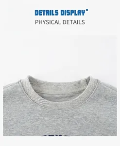 Detail of grey crewneck sweatshirt neckline featuring ribbed collar and reinforced tape