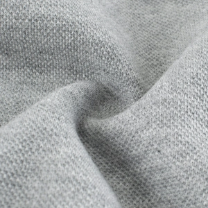 Close-up of soft grey knitted jersey fabric texture for high-quality children sweatshirt