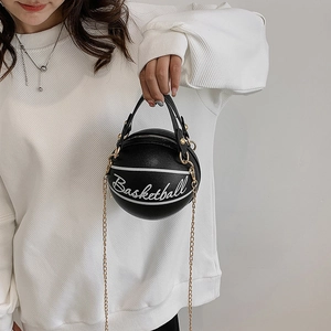 Chic black leather basketball-shaped crossbody bag with gold chain strap for women