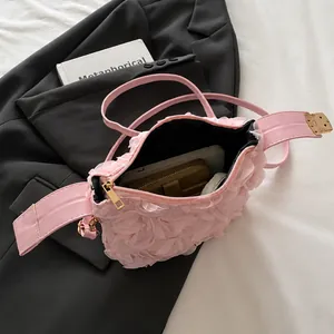 Interior view of pink floral shoulder bag showing capacity for phone and long wallet