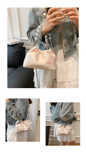 Three views of a pink satin pleated bag with floral embroidery and pearl handle