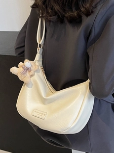 Off-white half-moon shoulder bag in premium PU leather with a cute plush bear charm