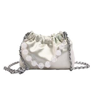 Chic pleated drawstring underarm bag in creamy satin with bead handle and chain strap