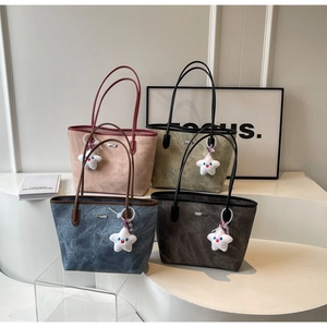 Detailed comparison of four vintage tote bags in pink, olive, blue, and grey with star charms