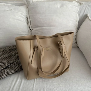 Minimalist khaki PU leather tote bag for office commuters in a high capacity design