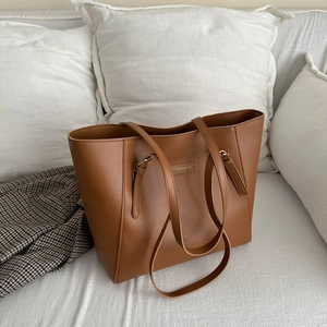 Minimalist caramel brown leather tote bag with large capacity for women's daily commute