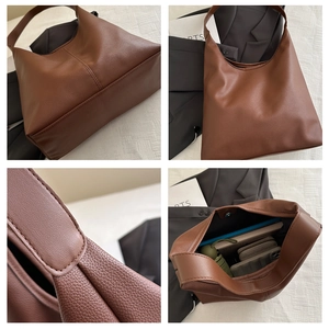 Detail view of brown lychee texture tote bag showing interior space and handle quality