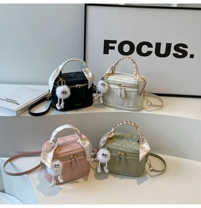 Detailed collection of quilted box bags in black white pink green with silk scarves and charms