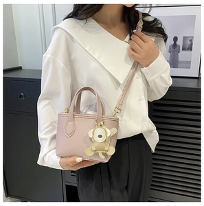 Pink lychee texture mini tote bag with cute bear pendant and long shoulder strap
