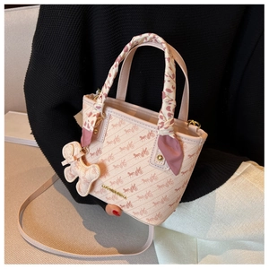 Pink bucket bag with vintage carriage print, scarf handle and teddy bear charm