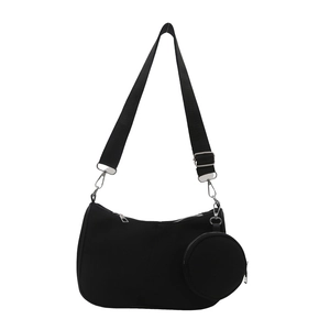 Black nylon crescent shoulder bag with adjustable strap and detachable round pouch
