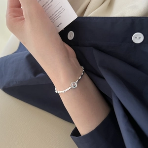 S925 silver bracelet featuring pink tulip pendant and bamboo-style bead design on wrist