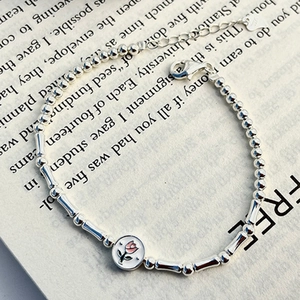 S925 sterling silver tulip bamboo bracelet with pink flower pendant on vintage book base