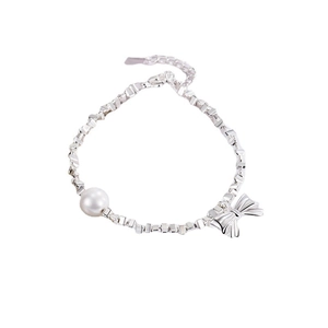 S925 sterling silver bow bracelet with irregular silver beads and a freshwater pearl accent
