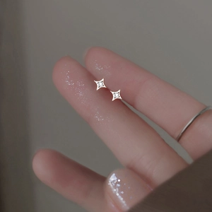 Minimalist S999 sterling silver four-pointed star stud earrings with bright zircon stone