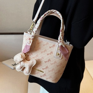 Beige tote bag with horse carriage print, silk scarf handle and leather dog charm