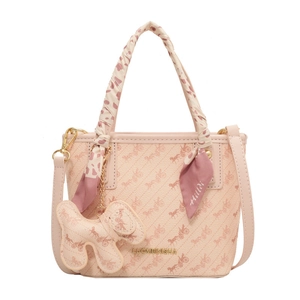 Pink printed tote bag with carriage pattern, silk scarf handle, and dog charm accessory