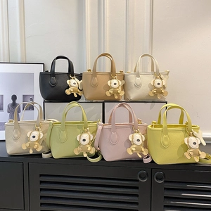 Minimalist litchi grain mini bucket bags in seven colors with cute cartoon pendants