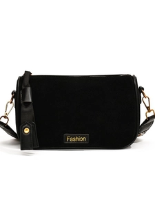 Vintage black suede pillow bag with golden metal hardware and a Fashion label tag