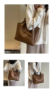 Detail view of brown quilted tote bag with chain strap and triangular leather patch