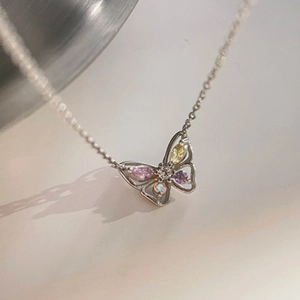 Silver butterfly necklace with hollow design and colorful zircon gemstone inlays