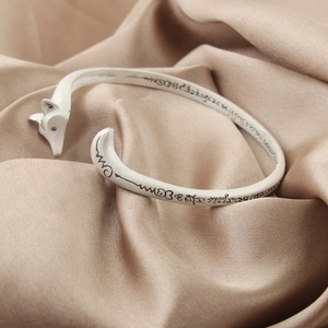 S925 silver open fox bracelet with etched scriptures on luxury champagne silk fabric